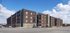 Richmond apartment for rent - a large brick building on the corner of a city street